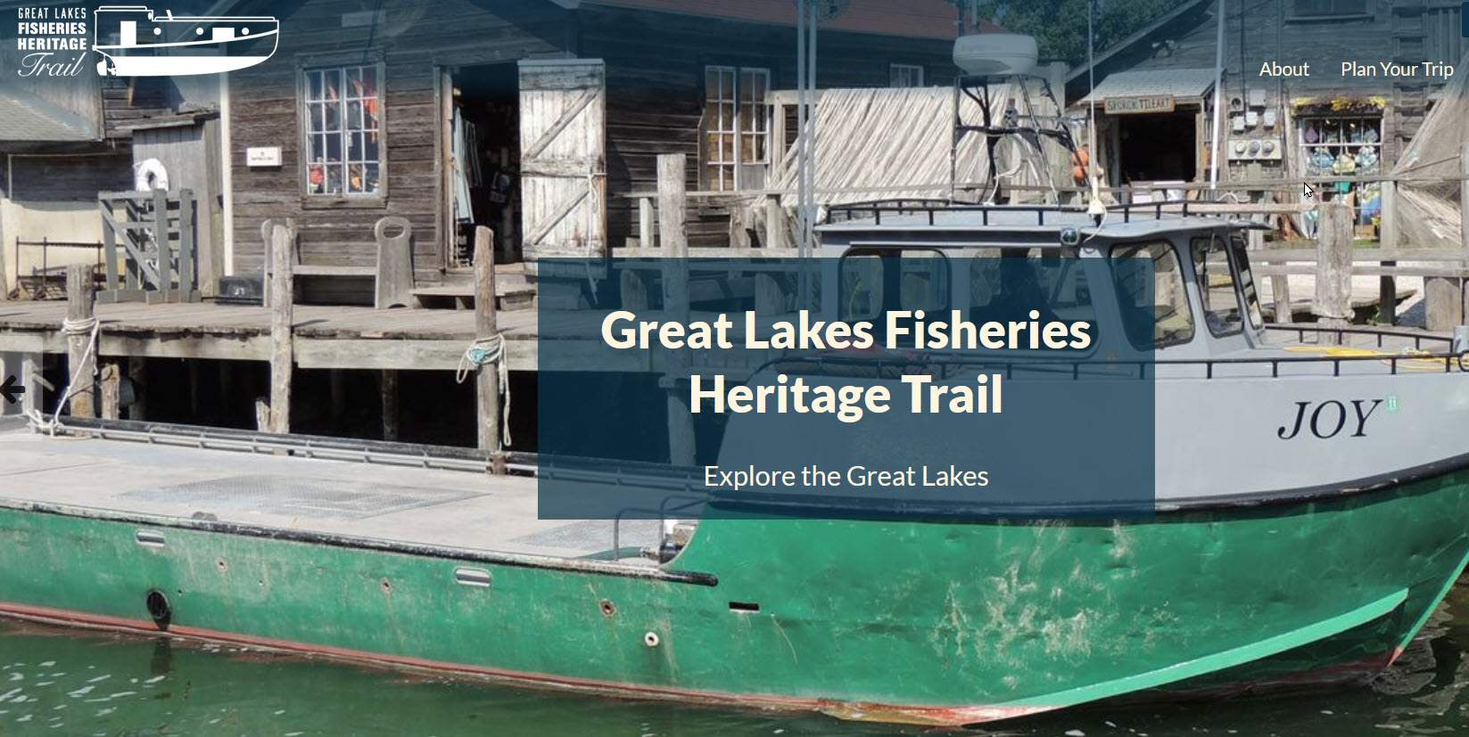 front page of the Great Lakes Fishery Heritage Trails website for decoration. Shows the boat Joy docked in Fishtown.